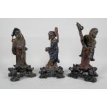 Three Oriental carved and lacquered wood figures of sages, 10" high, A/F