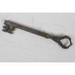 An antique Persian metal key made from a gun barrel, 9" long