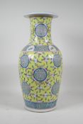 A Chinese yellow ground porcelain vase decorated with auspicious symbols, bats and peaches, 6