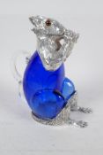 A silver plate and blue glass decanter in the form of a squirrel, 7" high
