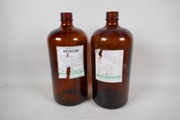 Two brown glass chemist bottles, 12" high