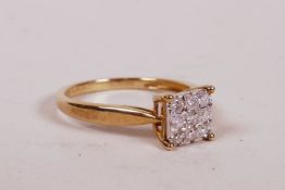 A 9ct yellow gold ring set with a cluster of nine diamonds, 1.6g, size 'L'
