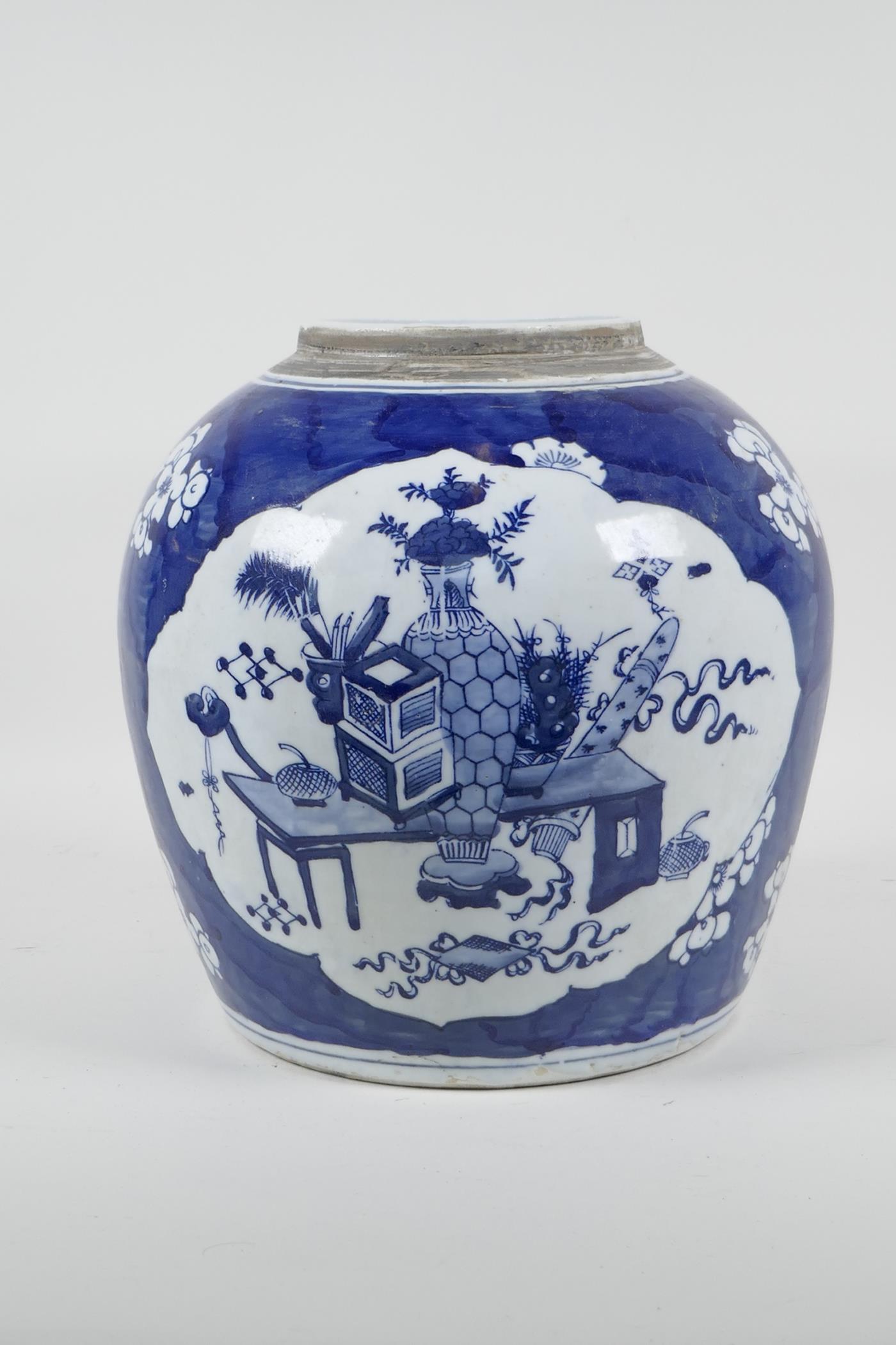 An early C20th Chinese blue and white porcelain jar with decorative panels depicting objects of