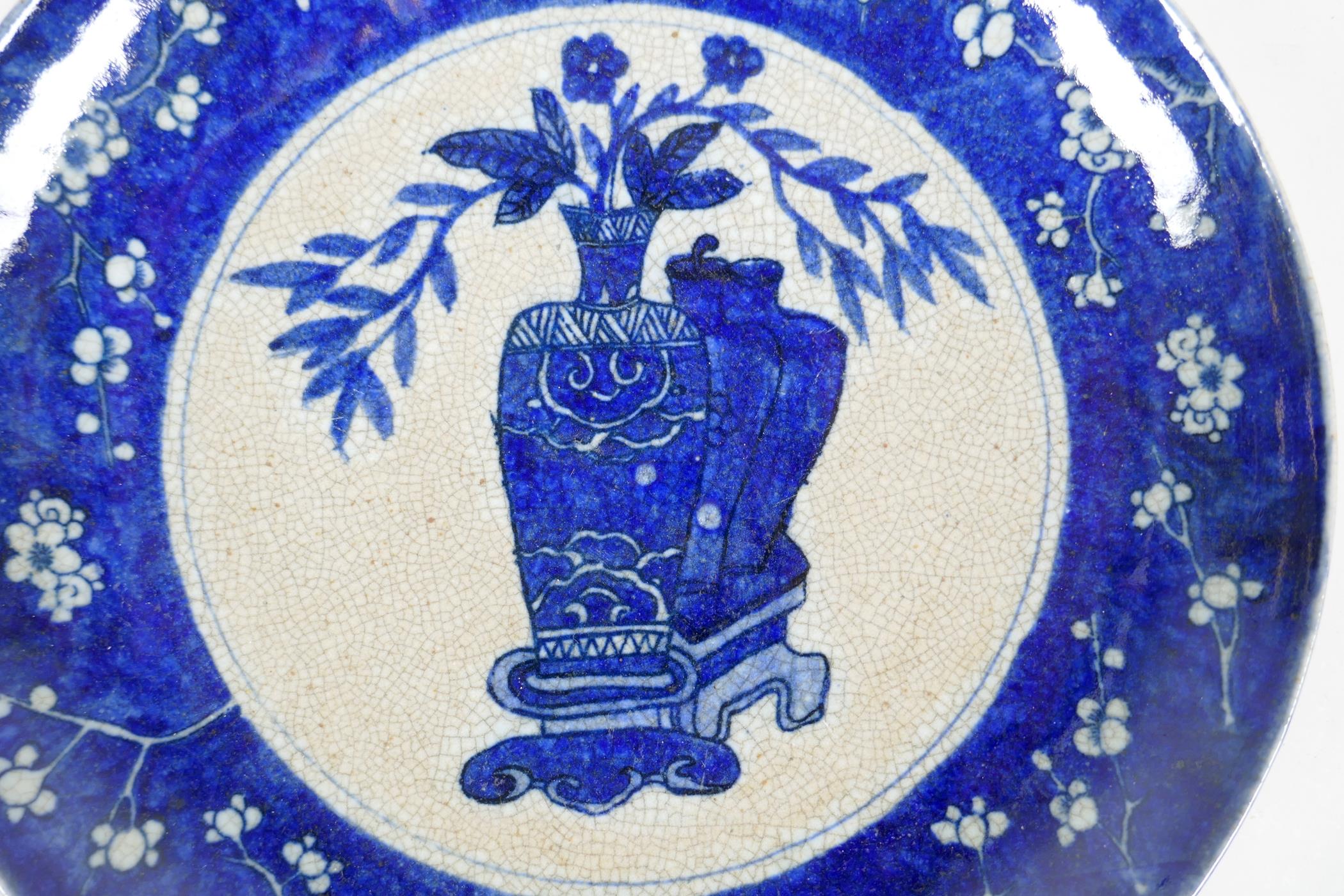 A Chinese early C20th blue and white crackleware charger decorated with objects of virtu within a - Image 2 of 3