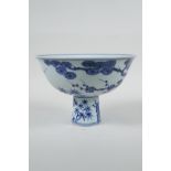 A Chinese blue and white porcelain stem bowl with cypress tree, prunus blossom and bamboo