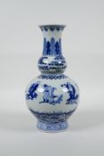A Chinese blue and white porcelain double gourd vase decorated with the Eight Immortals, 6 character