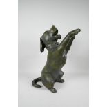 A filled bronze of a playful dog on its hind legs, 17" high