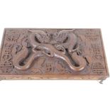 An antique carved wood artist's box, the lid heavily carved with dragons and symbols inside and out,