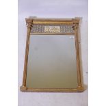 A good Regency pier glass, with inset eglomise panel and bevelled mirror glass, fluted columns