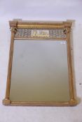 A good Regency pier glass, with inset eglomise panel and bevelled mirror glass, fluted columns