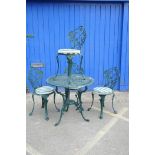A cast aluminium garden table and chairs, the circular table with pierced decoration and three leg