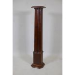 An early C20th mahogany torchere formed as four conjoined pillars, 44" high
