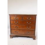 A Georgian Chippendale style mahogany chest of drawers, with a brushing slide and three short over