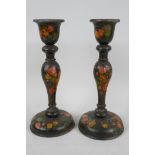 A pair of Kashmiri papier mache candlesticks painted with flowers, 9½" high