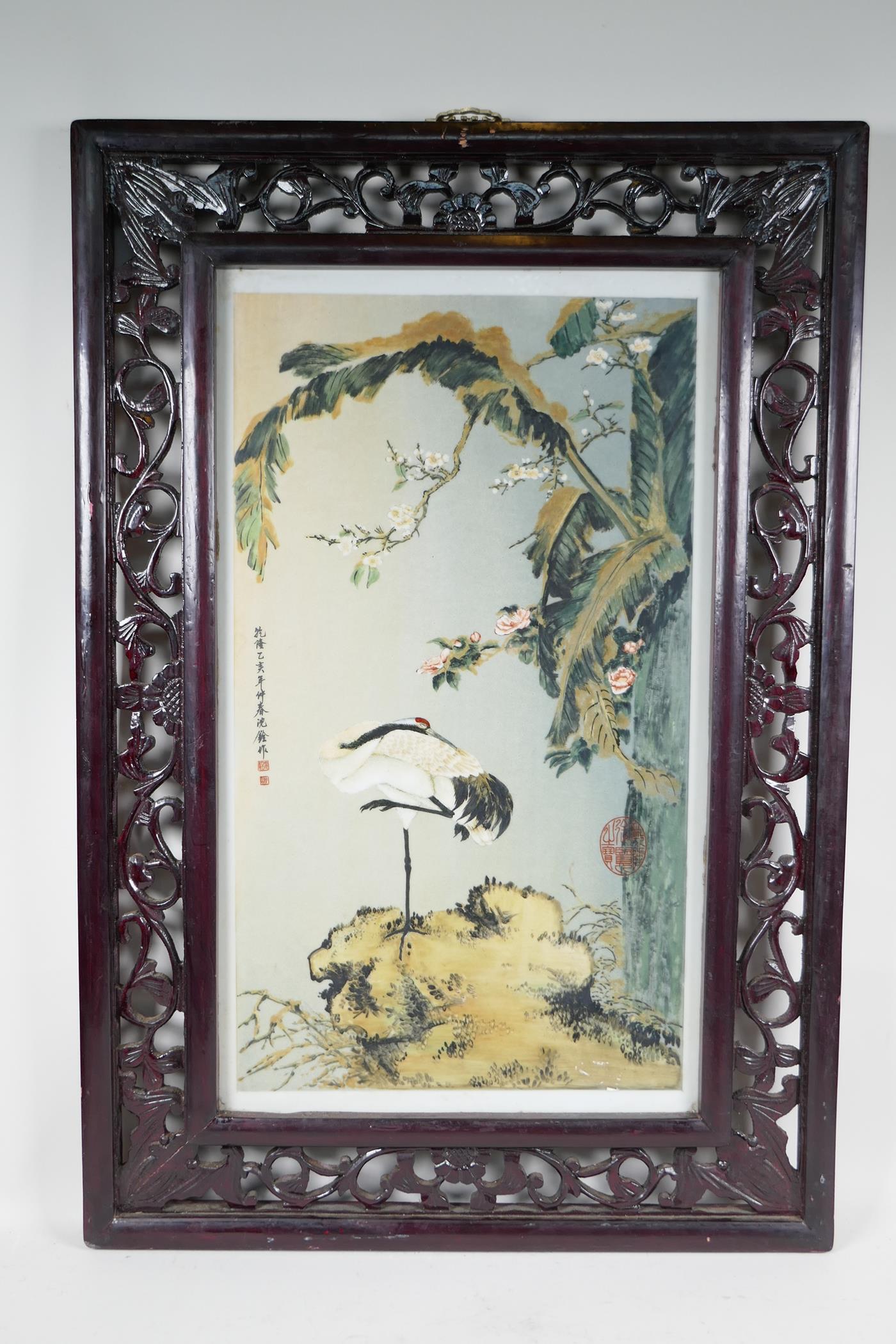 A Chinese polychrome porcelain panel decorated with a crane standing beneath trees in blossom, in - Image 2 of 2