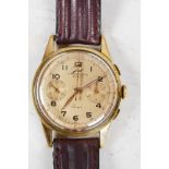 A vintage Swiss made gentleman's wristwatch by Janil, the face with secondary day and seconds dial