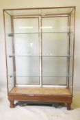 An early C20th shop display cabinet, the rear doors with etched decoration and company logo "S & S",