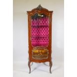 An early C20th walnut bombe shaped display cabinet with vernis Martin panels, brass mounts and