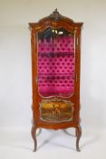 An early C20th walnut bombe shaped display cabinet with vernis Martin panels, brass mounts and