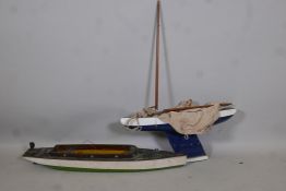 A model pond yacht with lead keel, A/F, 24" long, together with a model motor launch, 33" long, both