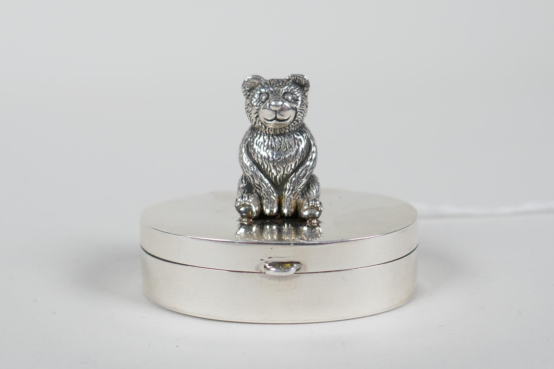 A 925 silver needle box with a teddy bear pincushion mount to the lid, 1½" wide, 1" high