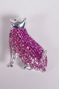 A 925 silver brooch in the form of a cat, set with coloured cubic zirconia, 1½" high