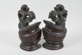 Two well carved mahogany terminals, 8" high