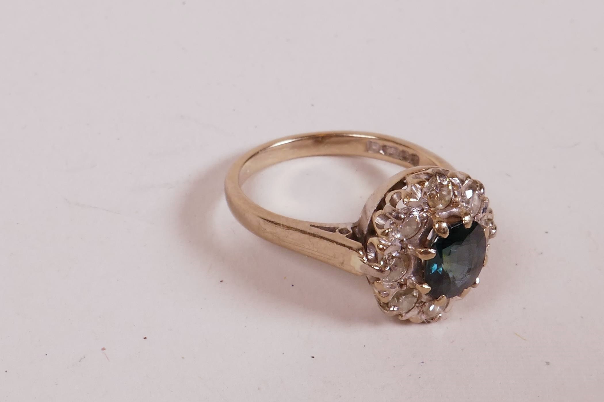 An 18ct white gold dress ring, set with a sapphire and eight diamonds, sapphire approximately 1ct, - Image 4 of 4