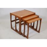 A nest of three G Plan 'Quadrille' teak occasional tables, label to base, 21" x 17" x 19" high