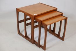 A nest of three G Plan 'Quadrille' teak occasional tables, label to base, 21" x 17" x 19" high