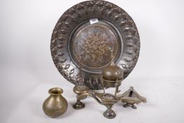 An antique Indian copper bowl with rubbed silver plating, 16" diameter, a brass sprinkler, two