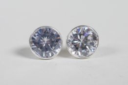 A pair of silver and cubic zirconium stud earrings