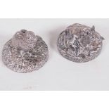 Two small filled silver figurines of animals on circular bases, a rabbit and a mouse under a leaf,