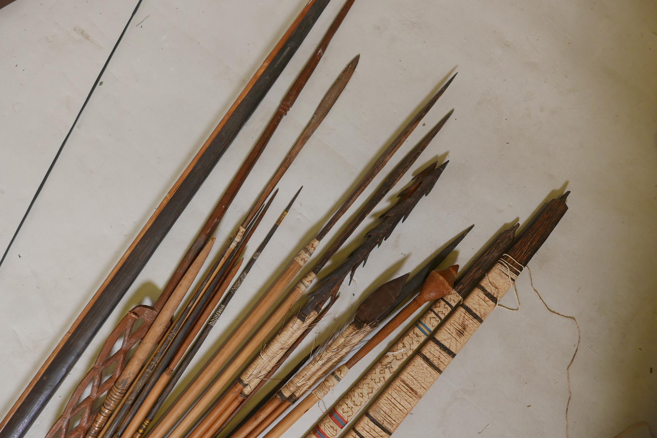 A collection of tribal longbows and spears, most with bamboo shafts and all with wood tips, - Image 2 of 4