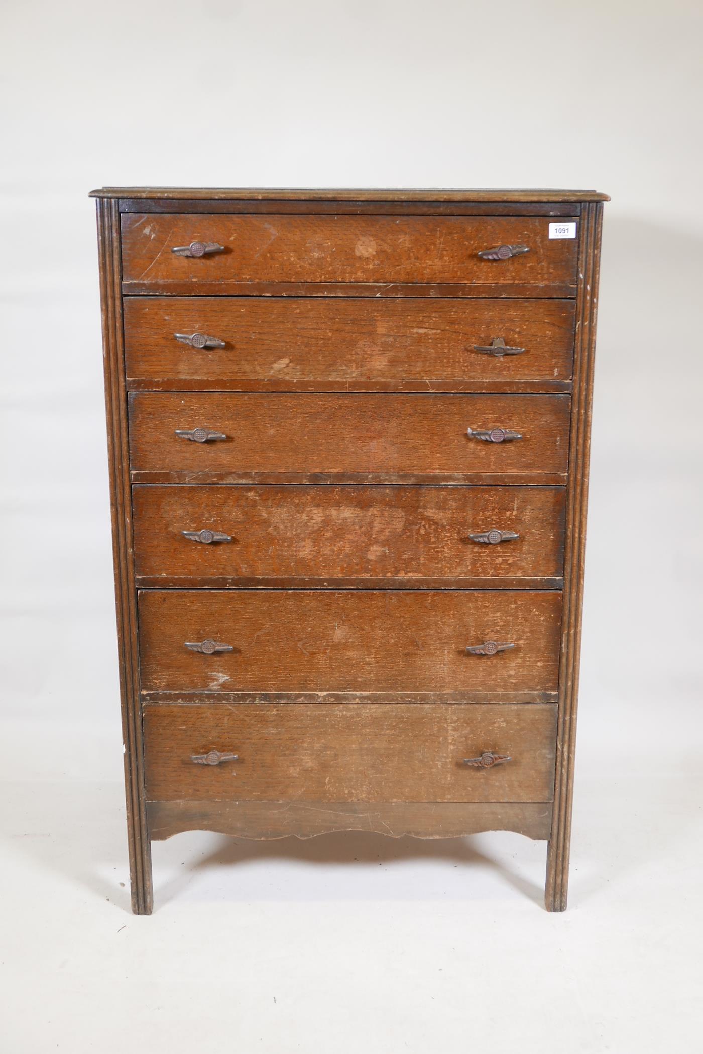 A 1930s oak tallboy with six graduated drawers, 30" x 17", 47" high
