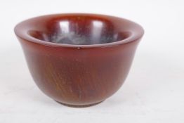 A Chinese carved horn bowl, 4 character mark to base, 4" diameter