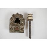 A Tibetan copper and embossed white metal shrine, 5½" x 4", together with a bone and brass prayer