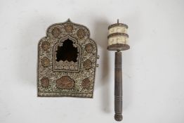 A Tibetan copper and embossed white metal shrine, 5½" x 4", together with a bone and brass prayer