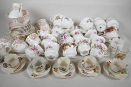 A quantity of pottery and porcelain teawares including a Royal Doulton tea service, Wilkinson five