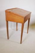 A C19th pine clerk's desk, raised on square tapering supports, 29" x 22" x 37"