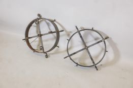 A pair of C19th/early C20th wrought iron game hooks, with conversions for electricity, 16½" diameter