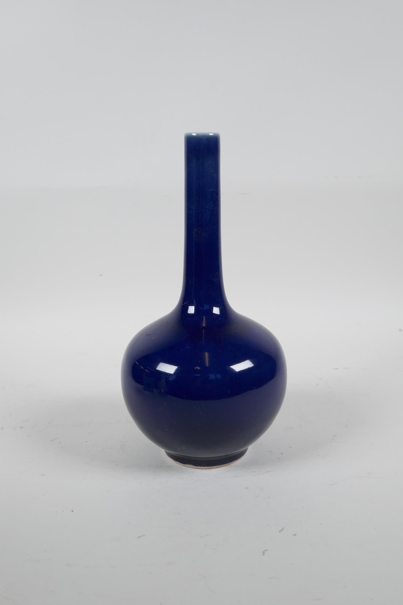 A Chinese powder blue glazed porcelain bottle vase with a slender neck, 8½" high