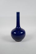 A Chinese powder blue glazed porcelain bottle vase with a slender neck, 8½" high