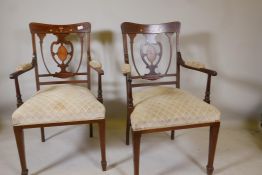 A pair of Victorian inlaid mahogany parlour chairs, with pierced heart shaped splat backs and open