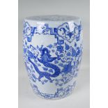 A Chinese blue and white porcelain garden seat decorated with a dragon and phoenix, 17½" high