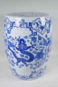 A Chinese blue and white porcelain garden seat decorated with a dragon and phoenix, 17½" high