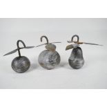 Three Asian metal model fruits, with leaves engraved with figures and flowers, 6" high