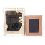 A brass framed Art Nouveau style easel mirror, 10" x 13", together with an inlaid photo frame,