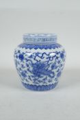 A Chinese blue and white porcelain ginger jar and cover decorated with mythical creatures and