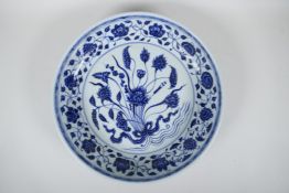 A Chinese Ming style blue and white porcelain dish with scrolling lotus flower decoration, 6